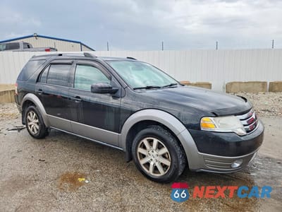 Czwarte zdjęcie samochodu z boku: 2009 FORD TAURUS X SEL VIN:1FMDK02W79GA02454 - miniatura