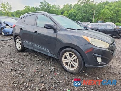 Czwarte zdjęcie samochodu z boku: 2010 HYUNDAI TUCSON GLS VIN:KM8JUCAC3AU084520 - miniatura