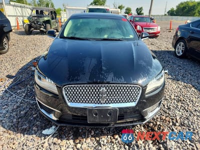 Piąte zdjęcie samochodu w środku: 2017 LINCOLN MKZ PREMIERE VIN:3LN6L5A91HR633805 - miniatura