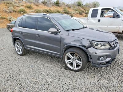 Czwarte zdjęcie samochodu z boku: 2014 VOLKSWAGEN TIGUAN S VIN:WVGBV3AX5EW560099 - miniatura