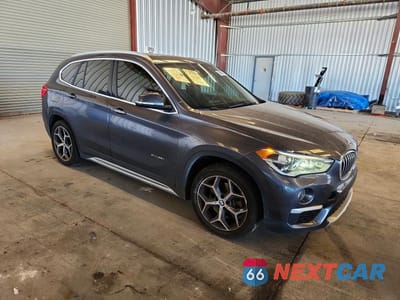 Czwarte zdjęcie samochodu z boku: 2017 BMW X1 XDRIVE28I VIN:WBXHT3Z39H4A65397 - miniatura