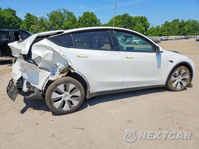 Trzecie zdjęcie samochodu z tyłu: 2023 TESLA MODEL Y VIN:7SAYGDEE7PA172239 - miniatura