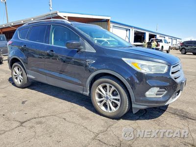 Czwarte zdjęcie samochodu z boku: 2017 FORD ESCAPE SE VIN:1FMCU9G99HUA95474 - miniatura