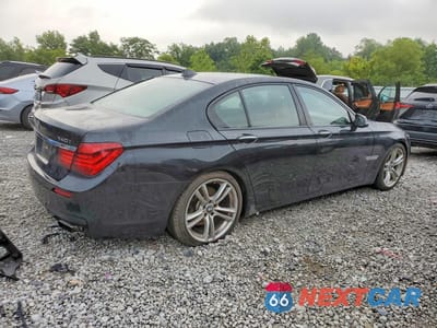 Trzecie zdjęcie samochodu z tyłu: 2015 BMW 740 I VIN:WBAYA6C50FGK16292 - miniatura