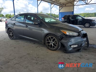 Czwarte zdjęcie samochodu z boku: 2018 FORD FOCUS SEL VIN:1FADP3H25JL256127 - miniatura