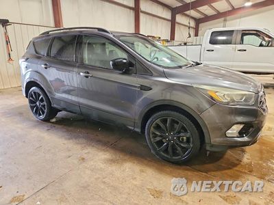 Czwarte zdjęcie samochodu z boku: 2017 FORD ESCAPE SE VIN:1FMCU9GD4HUA08410 - miniatura