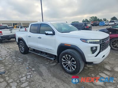 Czwarte zdjęcie samochodu z boku: 2024 GMC CANYON DENALI VIN:1GTP6FEK8R1196710 - miniatura