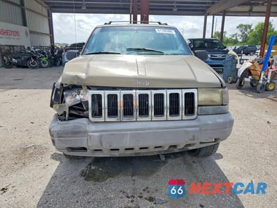 Piąte zdjęcie samochodu w środku: 1997 JEEP GRAND CHEROKEE LAREDO VIN:1J4FX58S9VC726870 - miniatura