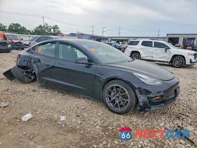 Czwarte zdjęcie samochodu z boku: 2023 TESLA MODEL 3 VIN:5YJ3E1EA2PF506821 - miniatura