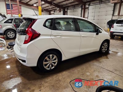 Trzecie zdjęcie samochodu z tyłu: 2020 HONDA FIT LX VIN:3HGGK5H48LM712806 - miniatura