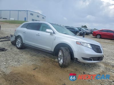 Czwarte zdjęcie samochodu z boku: 2017 LINCOLN MKT VIN:2LMHJ5FK4HBL00589 - miniatura