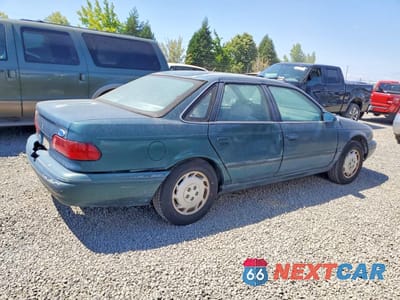 Trzecie zdjęcie samochodu z tyłu: 1994 FORD TAURUS GL VIN:1FALP52U4RA134528 - miniatura