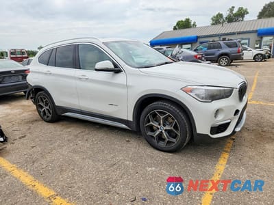 Czwarte zdjęcie samochodu z boku: 2018 BMW X1 XDRIVE28I VIN:WBXHT3C32J5K31037 - miniatura