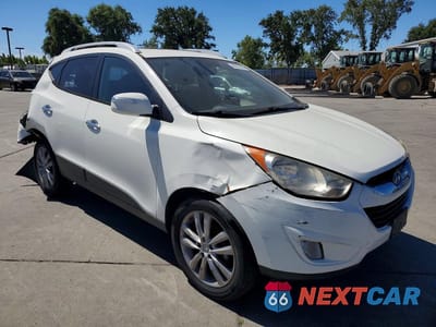 Czwarte zdjęcie samochodu z boku: 2010 HYUNDAI TUCSON LIMITED VIN:KM8JU3AC5AU085796 - miniatura