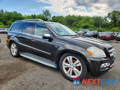 Czwarte zdjęcie samochodu z boku: 2010 MERCEDES-BENZ GL 350 BLUETEC VIN:4JGBF2FEXAA615474 - miniatura