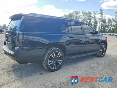 Trzecie zdjęcie samochodu z tyłu: 2019 CHEVROLET SUBURBAN C1500 LT VIN:1GNSCHKC5KR270546 - miniatura