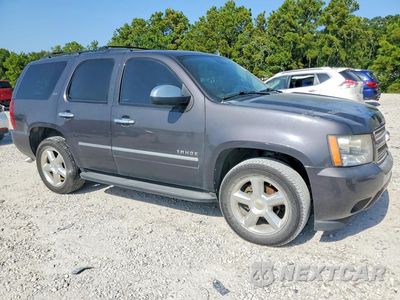Czwarte zdjęcie samochodu z boku: 2011 CHEVROLET TAHOE C1500 LTZ VIN:1GNSCCE01BR132202 - miniatura