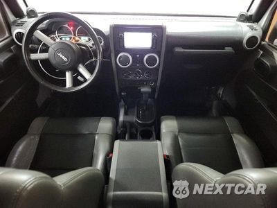Zdjęcie 8 z 13 samochodu: 2010 JEEP WRANGLER UNLIMITED SAHARA VIN:1J4BA5H10AL220409 - miniatura