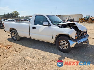 Czwarte zdjęcie samochodu z boku: 1999 GMC NEW SIERRA C1500 VIN:1GTEC14V6XE548381 - miniatura