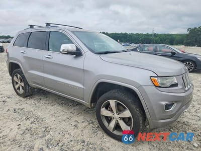 Czwarte zdjęcie samochodu z boku: 2015 JEEP GRAND CHEROKEE OVERLAND VIN:1C4RJFCG3FC787937 - miniatura