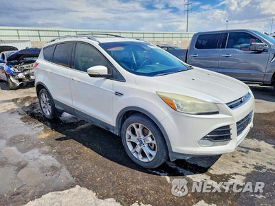 Czwarte zdjęcie samochodu z boku: 2014 FORD ESCAPE TITANIUM VIN:1FMCU9J96EUD52885 - miniatura