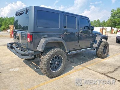 Trzecie zdjęcie samochodu z tyłu: 2010 JEEP WRANGLER UNLIMITED SPORT VIN:1J4BA3H13AL126867 - miniatura