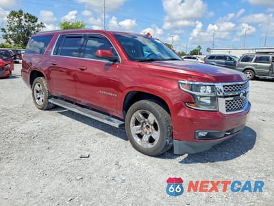 Czwarte zdjęcie samochodu z boku: 2019 CHEVROLET SUBURBAN C1500 LT VIN:1GNSCHKC0KR395423 - miniatura
