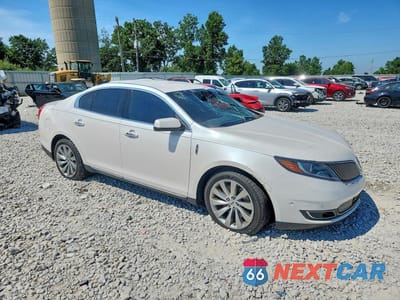Czwarte zdjęcie samochodu z boku: 2015 LINCOLN MKS VIN:1LNHL9DK6FG600611 - miniatura