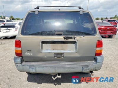 Zdjęcie 6 z 13 samochodu: 1997 JEEP GRAND CHEROKEE LAREDO VIN:1J4FX58S9VC726870 - miniatura