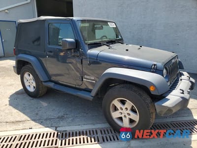Czwarte zdjęcie samochodu z boku: 2017 JEEP WRANGLER SPORT VIN:1C4AJWAG6HL538910 - miniatura