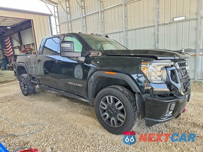 Czwarte zdjęcie samochodu z boku: 2022 GMC SIERRA K3500 AT4 VIN:1GT49VEY8NF100046 - miniatura
