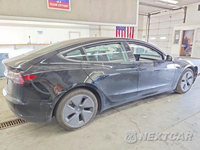 Trzecie zdjęcie samochodu z tyłu: 2021 TESLA MODEL 3 VIN:5YJ3E1EB6MF999066 - miniatura