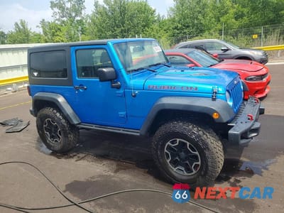 Czwarte zdjęcie samochodu z boku: 2016 JEEP WRANGLER RUBICON VIN:1C4BJWCG3GL218864 - miniatura