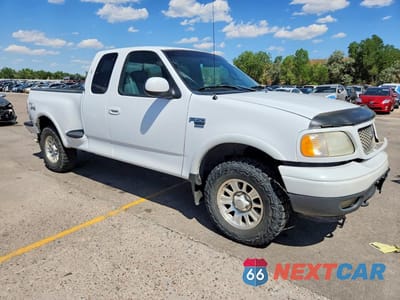 Czwarte zdjęcie samochodu z boku: 2001 FORD F150 VIN:1FTRX08L91KA08248 - miniatura