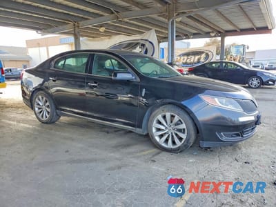 Czwarte zdjęcie samochodu z boku: 2016 LINCOLN MKS VIN:1LNHL9DK8GG602846 - miniatura