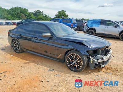 Czwarte zdjęcie samochodu z boku: 2021 BMW M550XI VIN:WBA13BK03MCF31993 - miniatura