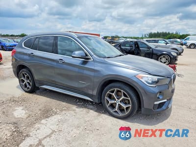 Czwarte zdjęcie samochodu z boku: 2018 BMW X1 VIN:WBXHU7C3XJ5H45838 - miniatura
