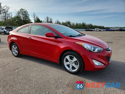 Czwarte zdjęcie samochodu z boku: 2013 HYUNDAI ELANTRA COUPE GS VIN:KMHDH6AE7DU016925 - miniatura