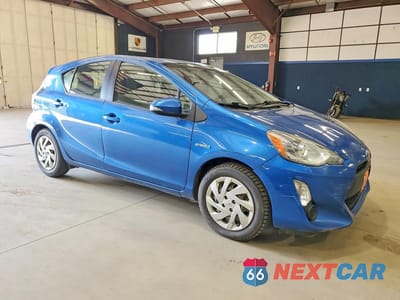 Czwarte zdjęcie samochodu z boku: 2015 TOYOTA PRIUS C ONE VIN:JTDKDTB34F1579860 - miniatura