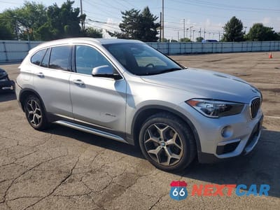 Czwarte zdjęcie samochodu z boku: 2018 BMW X1 XDRIVE28I VIN:WBXHT3C33J5F89282 - miniatura