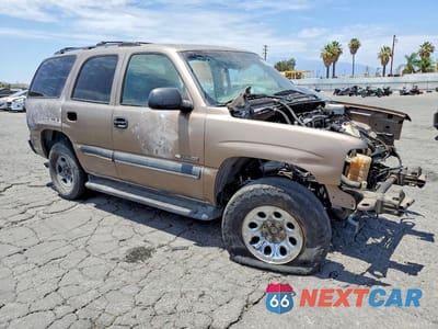 Czwarte zdjęcie samochodu z boku: 2003 CHEVROLET TAHOE C1500 VIN:1GNEC13T03R133065 - miniatura