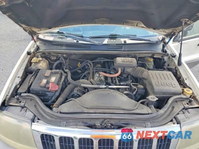 Zdjęcie 12 z 13 samochodu: 2003 JEEP GRAND CHEROKEE LAREDO VIN:1J4GW48SX3C605828 - miniatura