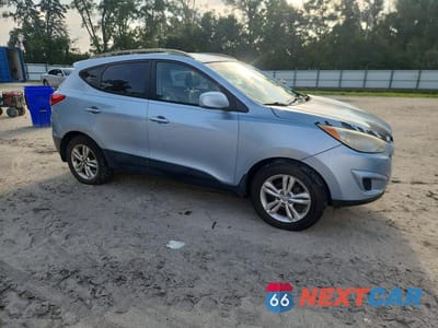 Czwarte zdjęcie samochodu z boku: 2011 HYUNDAI TUCSON GLS VIN:KM8JU3AC3BU244624 - miniatura