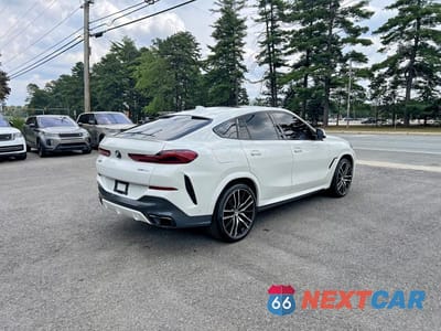 Czwarte zdjęcie samochodu z boku: 2021 BMW X6 SDRIVE 40I VIN:5UXCY4C01M9E83977 - miniatura