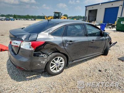 Trzecie zdjęcie samochodu z tyłu: 2017 FORD FOCUS SE VIN:1FADP3F29HL210507 - miniatura