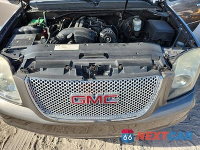 Zdjęcie 12 z 13 samochodu: 2011 GMC YUKON DENALI VIN:1GKS1EEF5BR335225 - miniatura