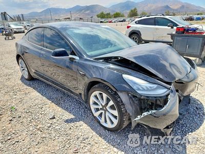 Czwarte zdjęcie samochodu z boku: 2019 TESLA MODEL 3 VIN:5YJ3E1EA8KF401886 - miniatura