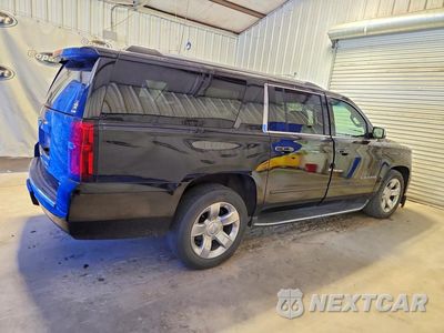 Trzecie zdjęcie samochodu z tyłu: 2017 CHEVROLET SUBURBAN C1500 PREMIER VIN:1GNSCJKC6HR344802 - miniatura