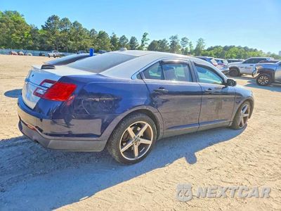Trzecie zdjęcie samochodu z tyłu: 2014 FORD TAURUS POLICE VIN:1FAHP2MK0EG103123 - miniatura