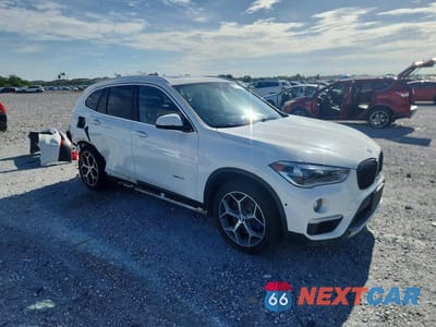 Czwarte zdjęcie samochodu z boku: 2017 BMW X1 XDRIVE28I VIN:WBXHT3C3XH5F72182 - miniatura